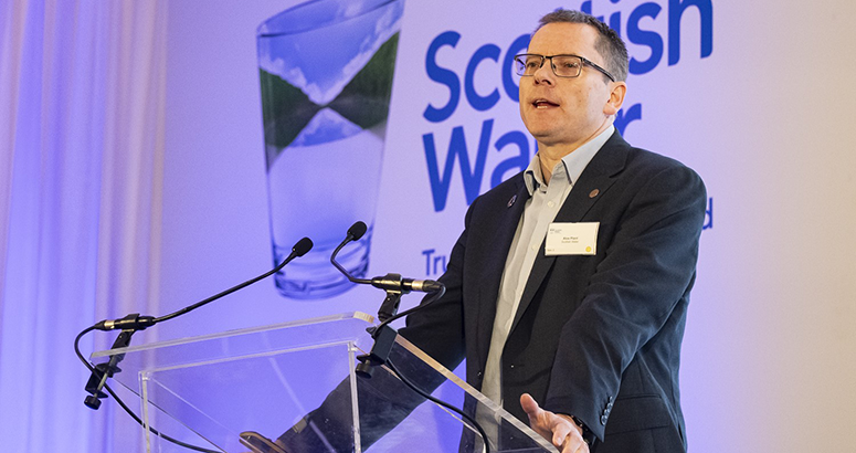 Annual Report and Accounts Performance and Prospects 2023/24 and Alex Plant Scottish Water CEO Alex Plant talking at a lectern at a recent supply conference
