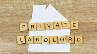 Private Landlord Guidance re Lead wooden table with Private Landlord spelled out in scrabble letters