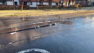 The force of the water has damaged the tarmac on the road King's Inch Road Sewer Burst