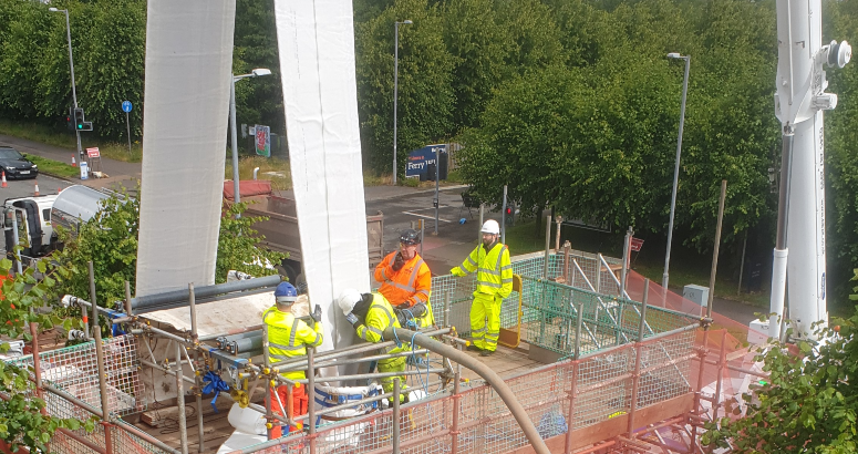 The new liner is lifted into position and then drawn through the existing pipe through an access pit Kings Inch Road Sewer Upgrade