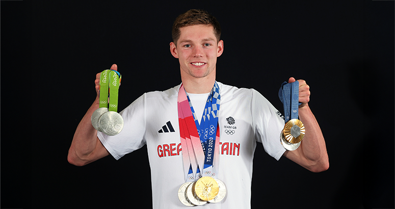 Generation H2O schools competition with Duncan Scott OBE Olympic swimming champion Duncan Scott OBE with his medals