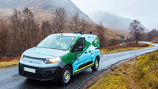 Charges 2025 to 2026 Scottish Water van on the road through Glencoe with snowy mountain backdrop