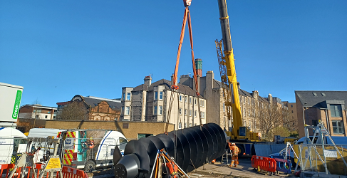 The screw pump is shown being lowered into place by a crane during the major operation The screw pump is shown being lowered into place by a crane during the major operation