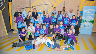 Generation H20 Water Cycle Workshop at St Pius Primary A young girl and boy, pupils from St Pius Primary School in Dundee,  busy with a water experiment at Scottish Water Generation H2O Water cycle workshop