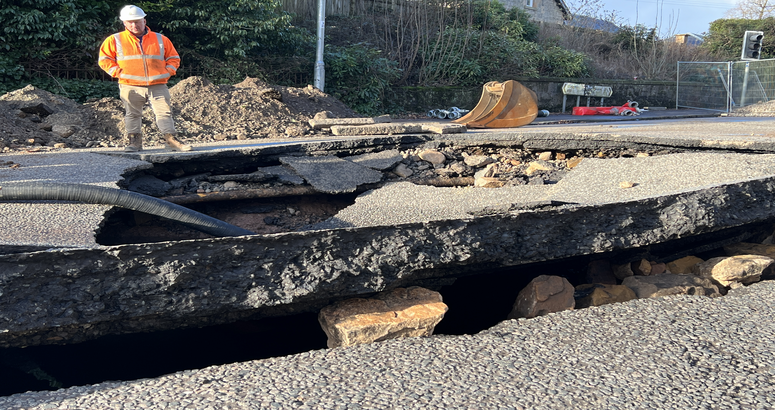 The road was severely damaged by the force of the burst Auchenhowie Milngavie Mains Burst